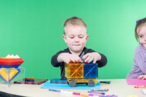 little boy playing with blocks